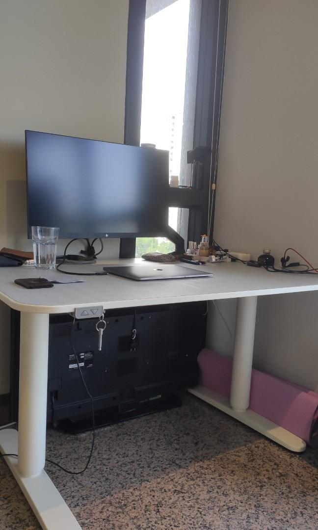 Ikea adjustable table (Category: Tables & Sets) located in Singapore. Submitted by cindylmy (Listing ID 1171453099, Image 1). Description: - fully functional IKEA Berkant 120cm x 80cm - height 65cm to 125cm, adjustable using a press of the button - comes with table surface protector (grey colour covering in photos, but is removable) you get a brand new looking table top - original price $719, great deal!!! - bought in early 2021 - selling because