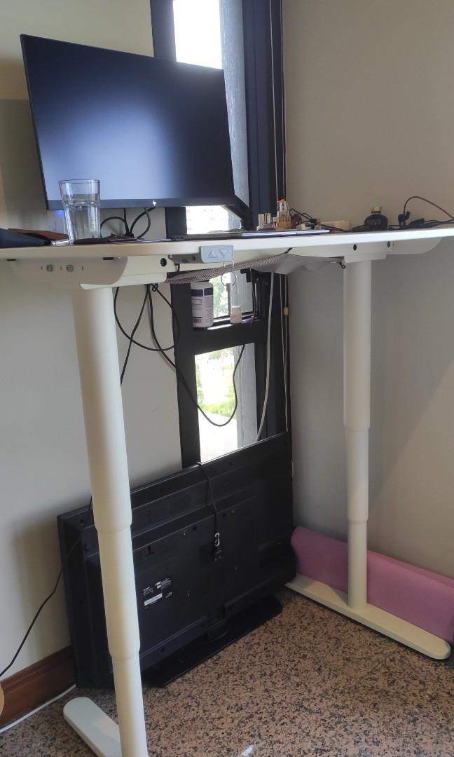 Ikea adjustable table (Category: Tables & Sets) located in Singapore. Submitted by cindylmy (Listing ID 1171453099, Image 2). Description: - fully functional IKEA Berkant 120cm x 80cm - height 65cm to 125cm, adjustable using a press of the button - comes with table surface protector (grey colour covering in photos, but is removable) you get a brand new looking table top - original price $719, great deal!!! - bought in early 2021 - selling because