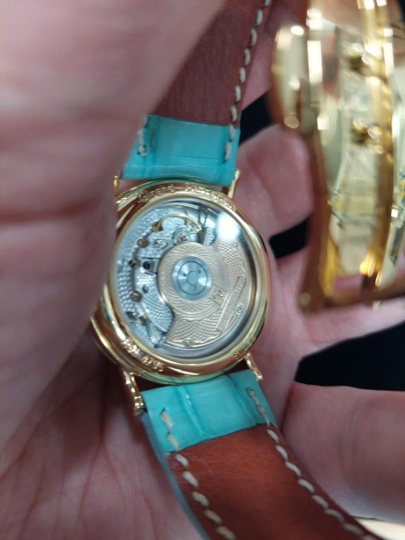 Gold watch with blue strap on sale