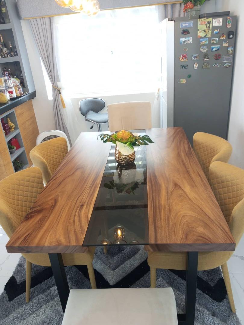 Wooden dining table with sales glass in the middle