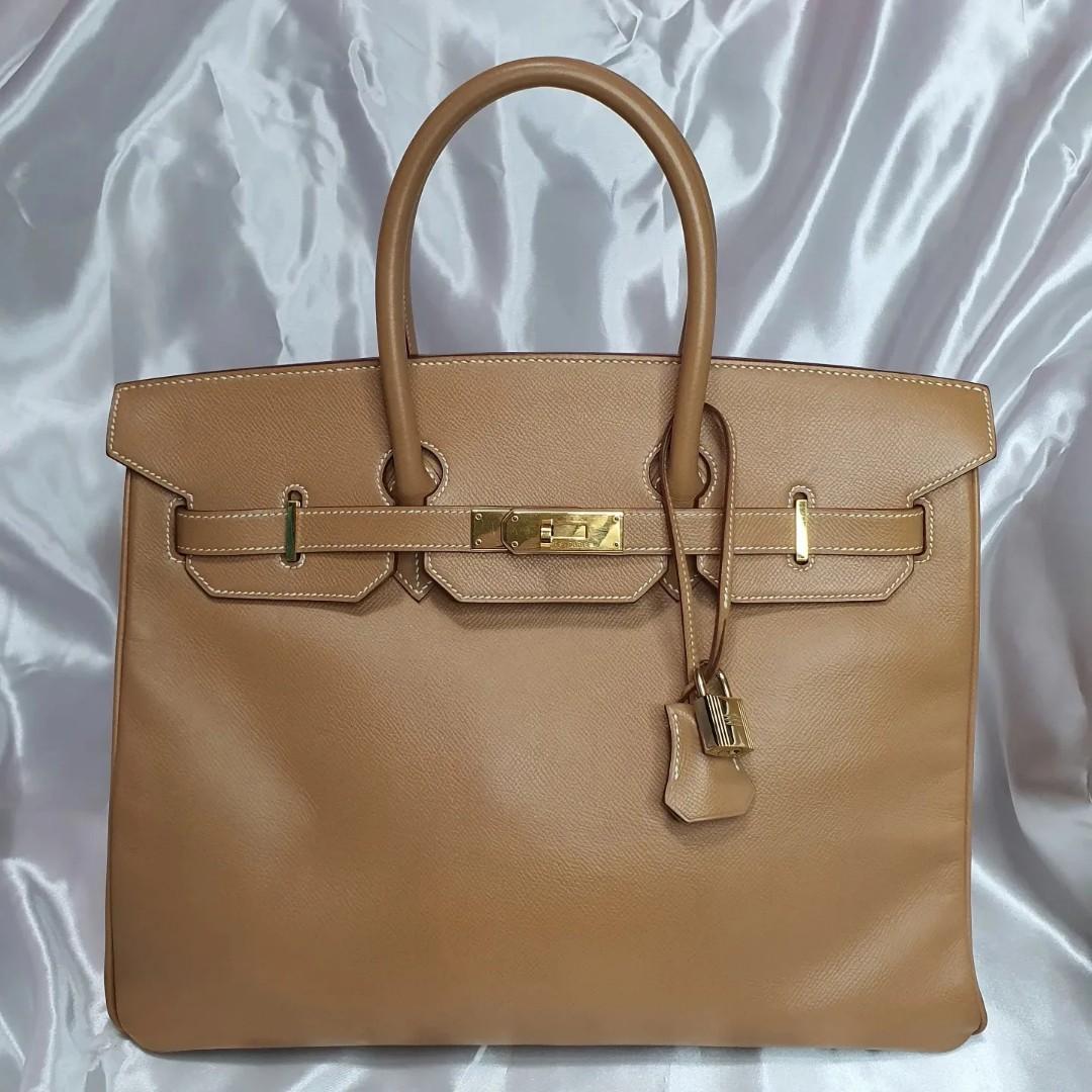 Hermes Birkin 35 (Category: Luxury Bags & Wallets) located in Paranaque City. Submitted by my_travelfinds (Listing ID 1177949204, Image 2). Description: Hermes Birkin Size: 35 Color: Natural Sable Leather: Courchevel Hardware: Gold Year stamp: B square/1998 Rank: AB+ (8.5/10 preloved condition) Inclusions: Clochette, lock, keys, dustbag, entrupy Price: Php 495,000 Please manage your expectations when buying a preloved bag. No return/No exchange u