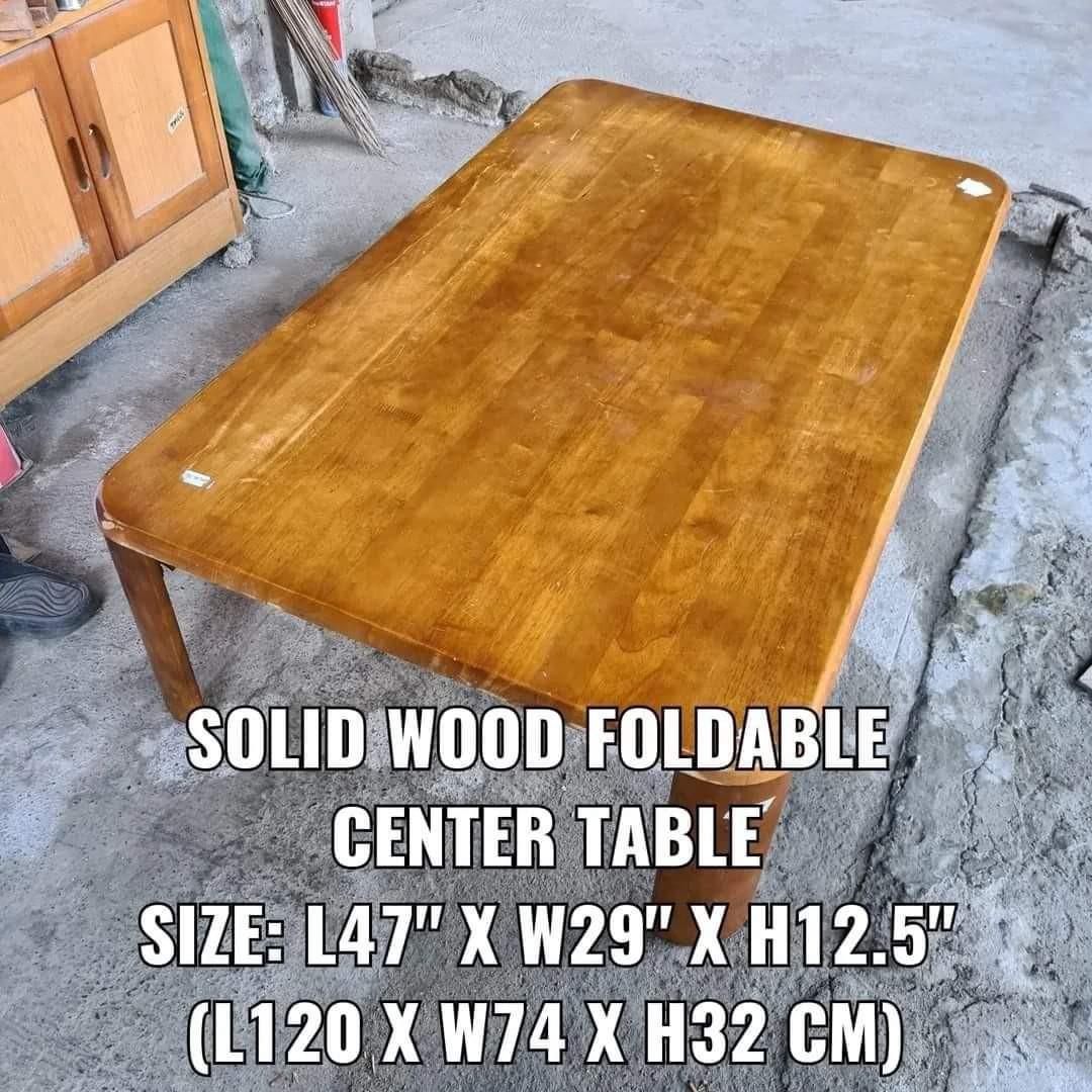 Low Height Center Table with Foldable Legs (Category: Tables & Sets) located in Malolos. Submitted by jestrelita (Listing ID 1177924104, Image 2). Description: Low Height Center Table with Foldable Legs P3,200 - Made in Vietnam - Foldable Legs - Heavy /sturdy / look like new - Full-body solid wood - Minimal body scratches only - Good condition.