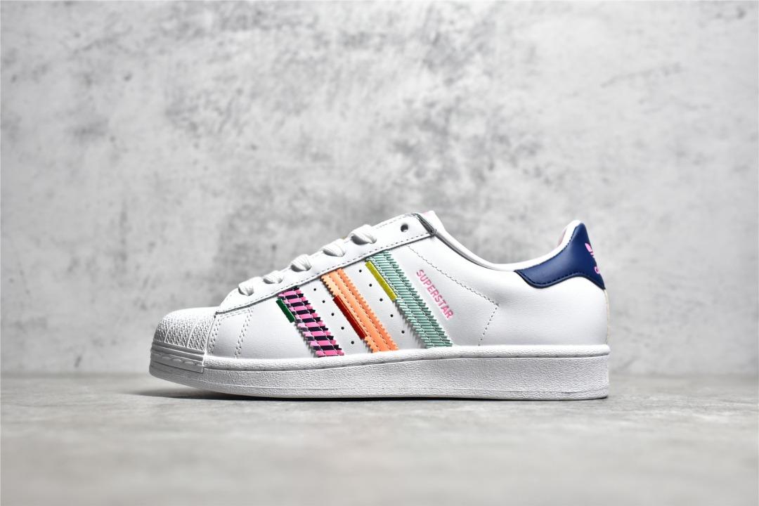 White adidas shoes with rainbow best sale stripes