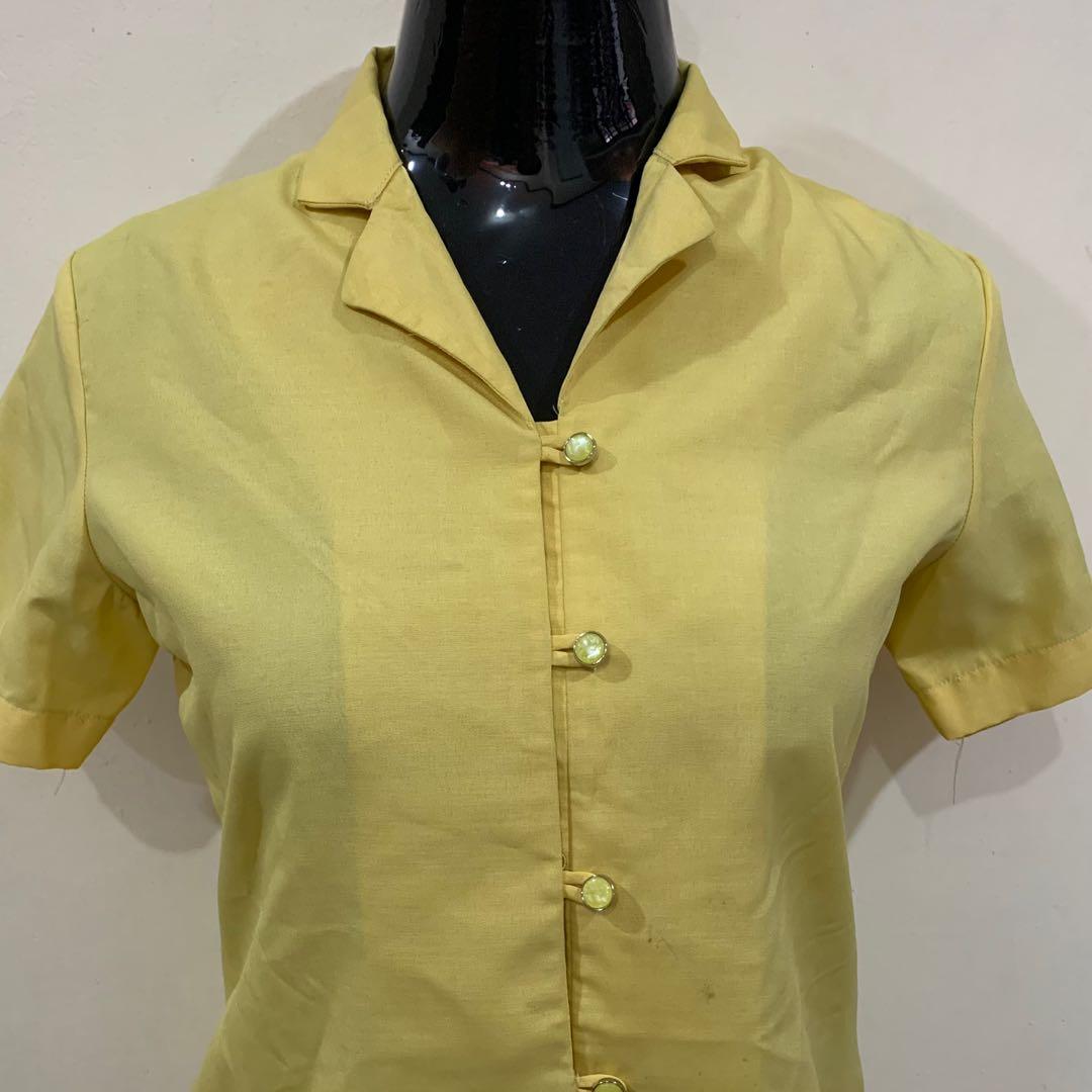 Yellow Button-down Office Uniform (Blouse) (Category: Blouses) located in Pasay City. Submitted by philippineartisansells (Listing ID 1178170004, Image 2). Description: Perfect pang-office. ✅Brand: - ✅Fits: S ✅Condition: Pre-loved, stored for quite some time ✅Features: may pa-slim cut sa likod, complete ang buttons, pasadya ito kaya matibay ang tahi ✅Issues: May konting stain na baka pwede pang maidaan sa laba (as seen in the photo) ✨Colors may v