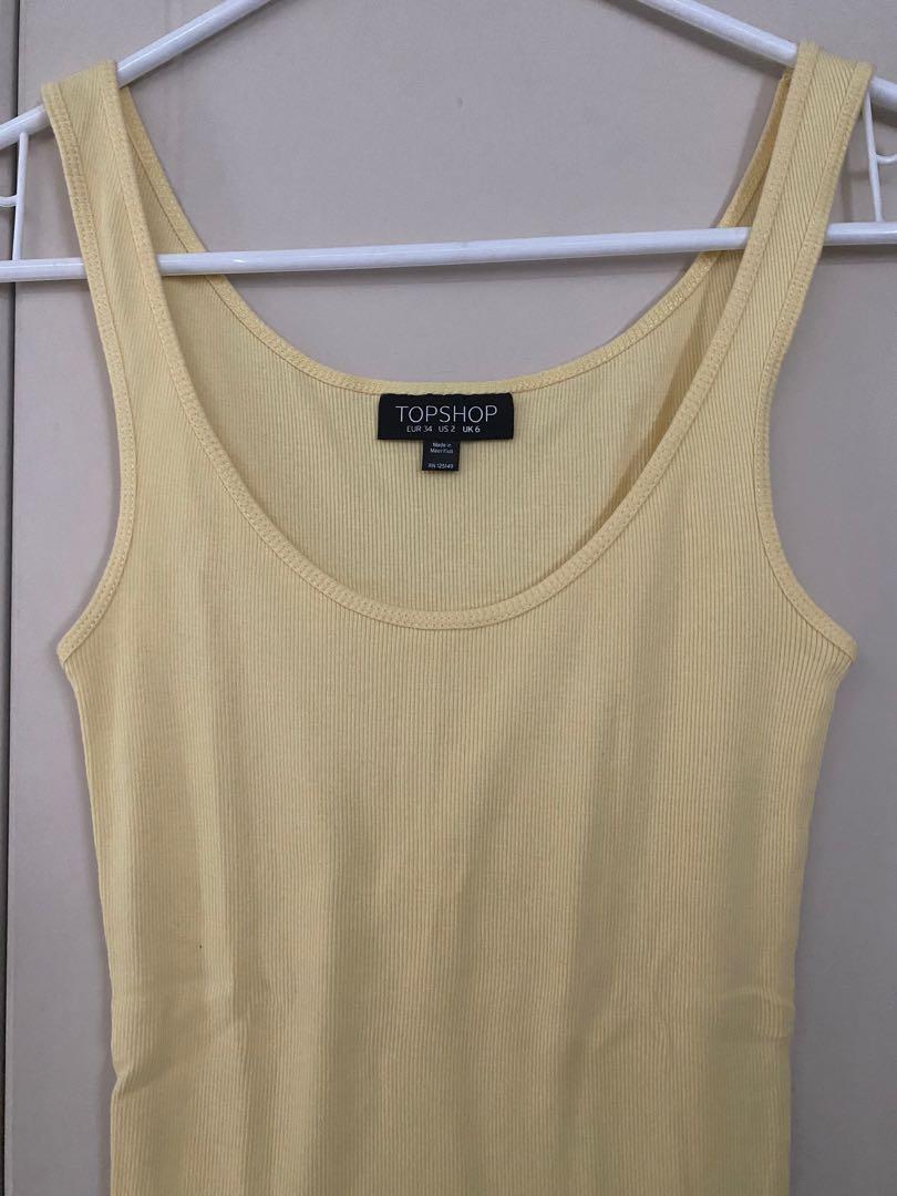 Topshop Ribbed Tank Top (Category: Sleeveless) located in Quezon City. Submitted by inxshop (Listing ID 1178486188, Image 2). Description: Topshop Ribbed Tank Top Size 6 Pastel Yellow color Cotton Can fit up to S/M frames Stretchable .