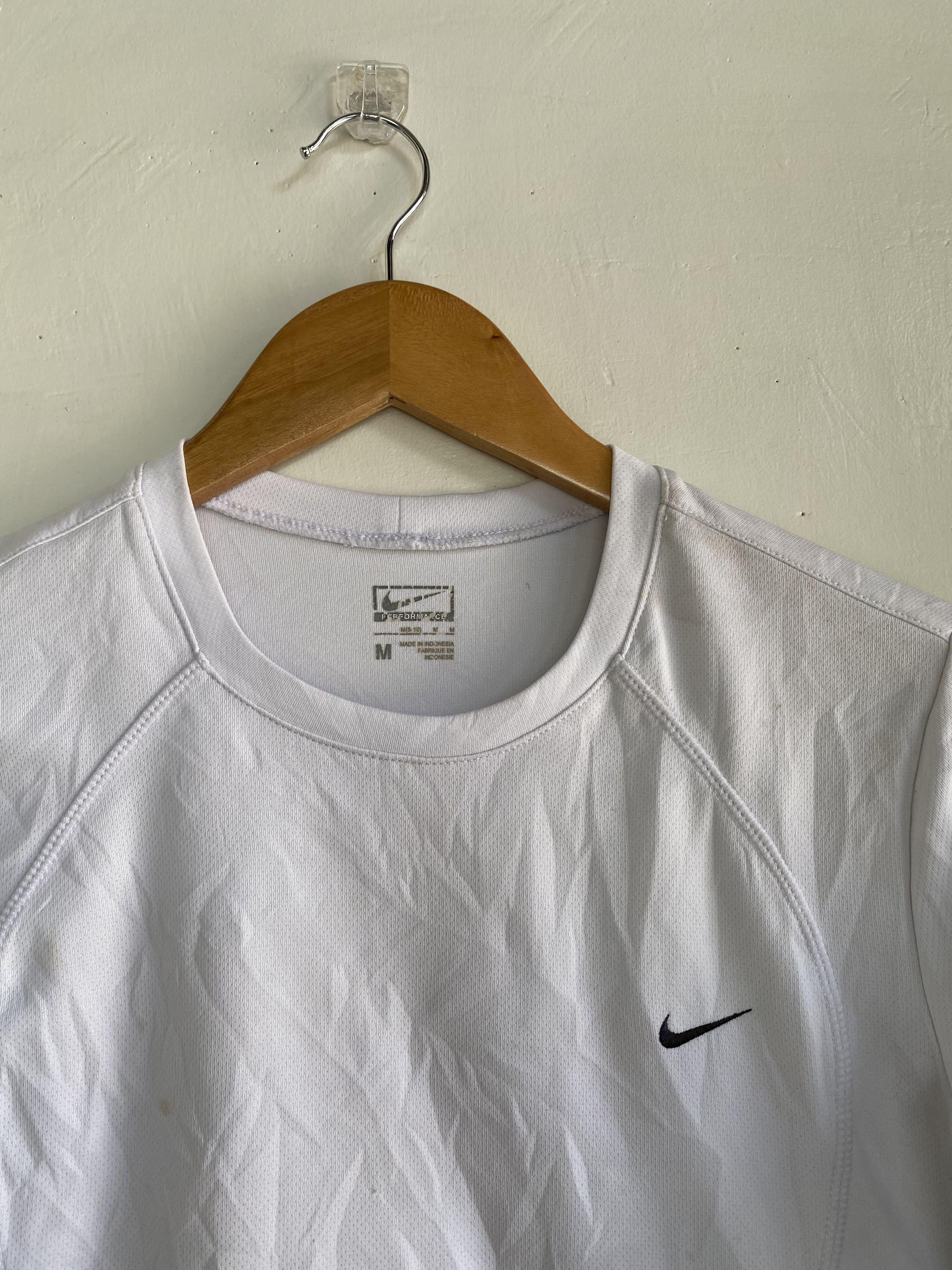 nike top with tick in middle