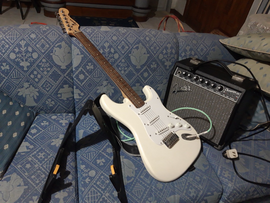 Electric Guitar with Amplifier; comes with 10 foot wire, stand and
