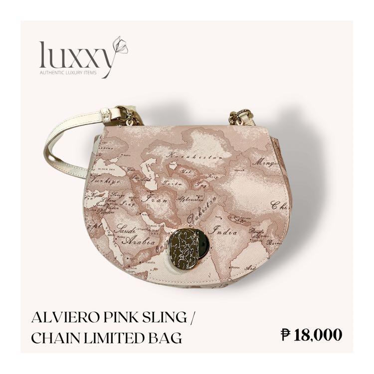 Alviero Pink Limited Bag (Category: Luxury Bags & Wallets) located in San Jose del Monte. Submitted by luxxyluxuryitems (Listing ID 1179395247, Image 1). Description: Let yourself be tempted by the unique style of the Bags by Donna di Alviero Martini Prima Classe and its iconic Geographic Print. ✨ Grab now this beautiful, limited editon Alviero Pink Sling / Chain Bag! ✔️ 💠 Authentic / Original 💠 Rank N (Brand New) 💠 Color: Pink 💠 Complete Inc
