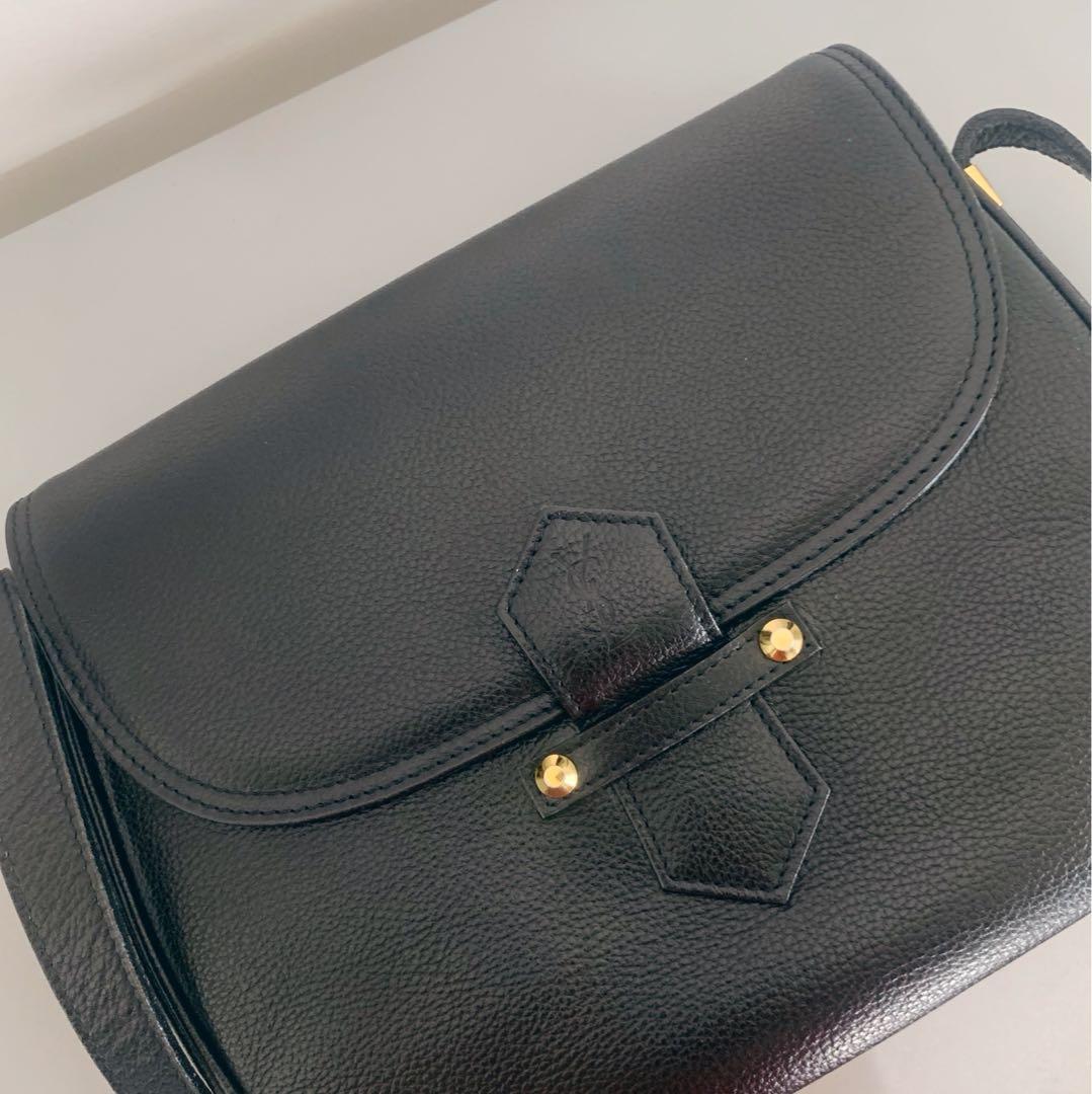 Authentic Yves Saint Laurent Black Shoulder Bag (Category: Luxury Bags & Wallets) located in Mandaluyong City. Submitted by random.objects (Listing ID 1179337179, Image 2). Description: Authentic Yves Saint Laurent Black Shoulder Bag - black with gold hardware - pebbled texture makes it low maintenance - magnetic closure with stamped YSL logo (3rd photo) - dimensions: 25cm x 21cm x 7cm - 1 exterior pocket, 2 interior pockets (photos 4 & 5) - logo