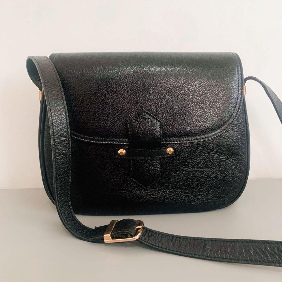 Authentic Yves Saint Laurent Black Shoulder Bag (Category: Luxury Bags & Wallets) located in Mandaluyong City. Submitted by random.objects (Listing ID 1179337179, Image 1). Description: Authentic Yves Saint Laurent Black Shoulder Bag - black with gold hardware - pebbled texture makes it low maintenance - magnetic closure with stamped YSL logo (3rd photo) - dimensions: 25cm x 21cm x 7cm - 1 exterior pocket, 2 interior pockets (photos 4 & 5) - logo