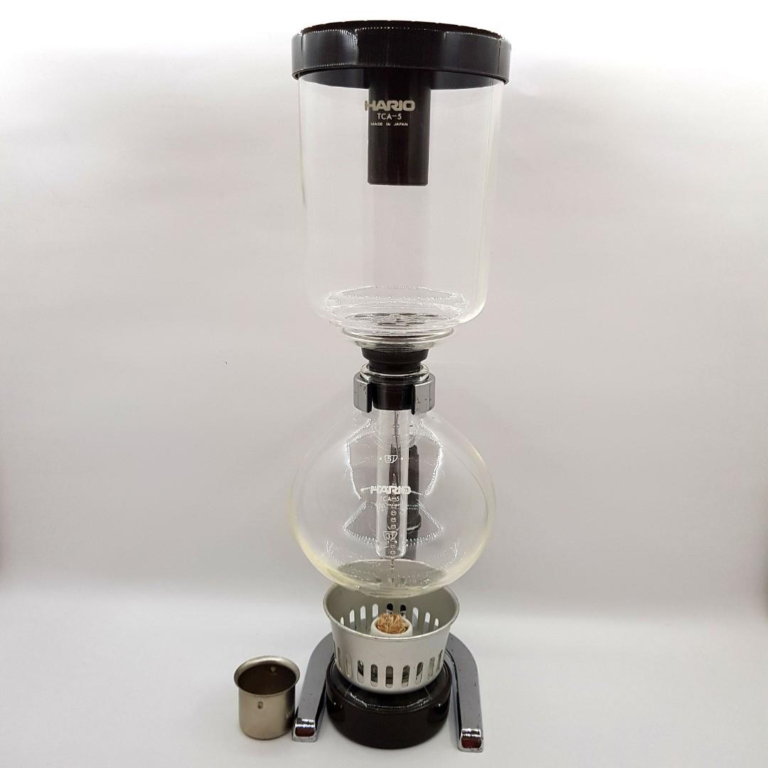 Hario Syphon TCA-5 coffeemaker (Category: Other Kitchenware & Tableware) located in Imus. Submitted by mostlyvintage (Listing ID 1179394245, Image 2). Description: 🎀 Hario Syphon TCA-5 coffeemaker 🎀 🎀 5-cup capacity 🎀 🎀 never been used; no box 🎀 🎀 last pic grabbed from the orange app (not my store) 🎀 clear glass; brownish hue is due to lighting 🎀 🌸 for fashion finds and other stuff, pls. visit my other store: https://carousell.app.link/