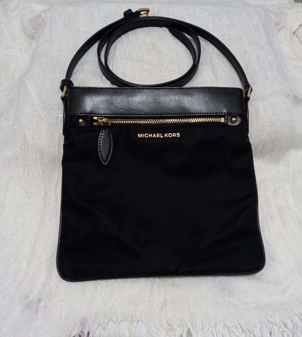 MK Cross Body Bag (Category: Luxury Bags & Wallets) located in Mandaluyong City. Submitted by jhing0609 (Listing ID 1179466577, Image 1). Description: MK black Cross body bag for Unisex. Adjustable strap. Size: Approx. H - 25 cm, L - 25.5cm (in photos). Never been used. No box & dust bag. You may nego pls send your offer..