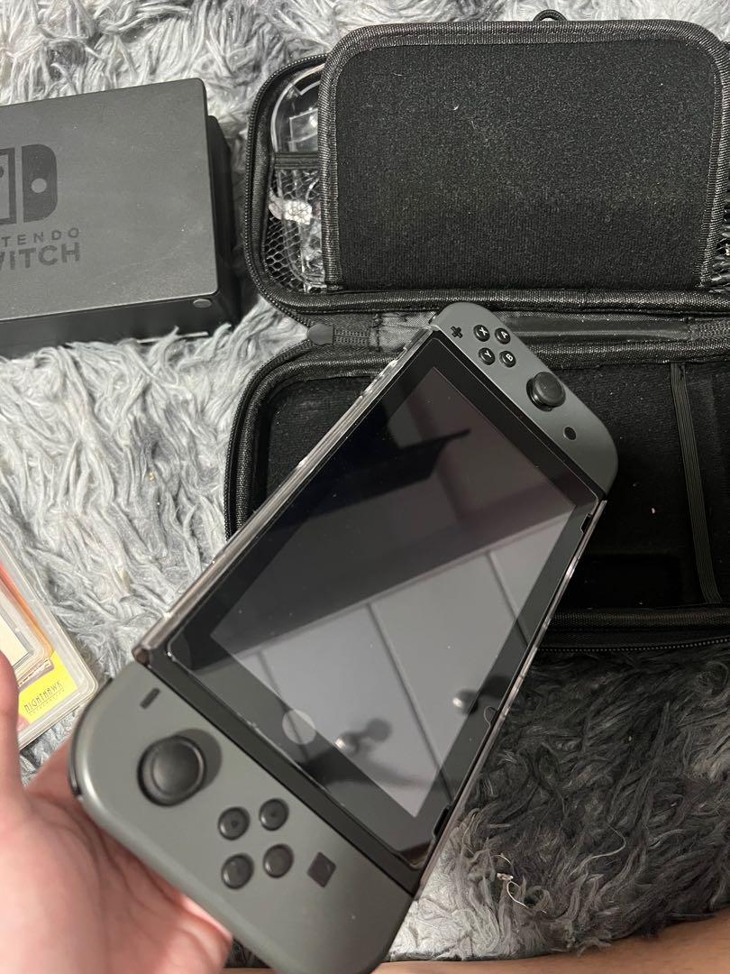Nintendo Switch V2 with Accessories & Games included (Category: Nintendo) located in Bulacan. Submitted by itslouisem (Listing ID 1179531253, Image 2). Description: Complete accessories 1 yr old only Like new with box & manual No scratches, installed screen protector since day 1 No issue 100%.