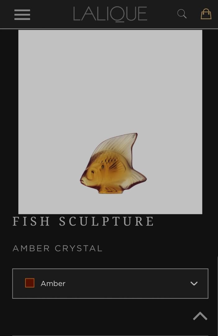 Lalique crystal fish sculpture (amber) (Category: Other Home Decor) located in Cebu City. Submitted by tuourb (Listing ID 1176149504, Image 1). Description: Lalique amber crystal fish sculpture -no flaws, kept in storage -box has some stains.