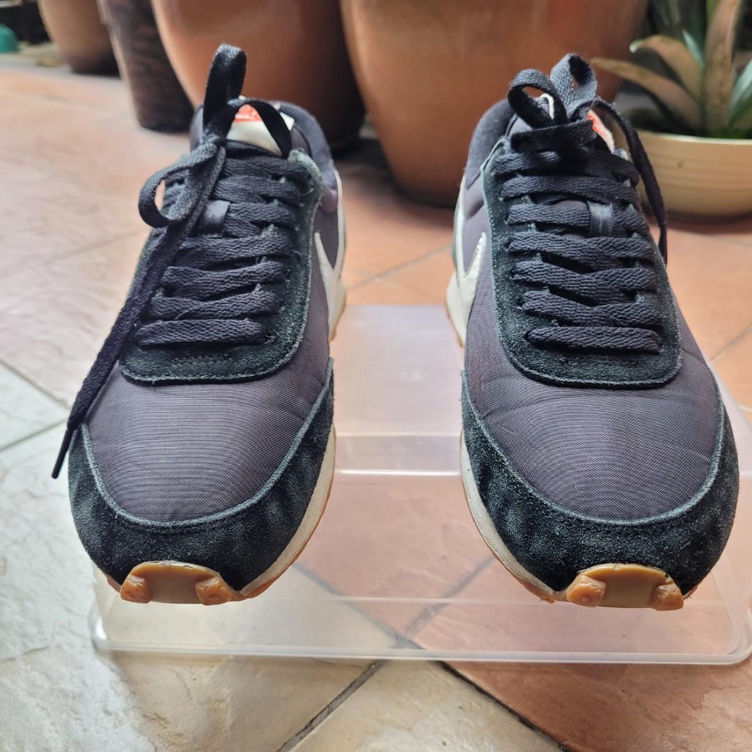 Nike tailwind vs daybreak top