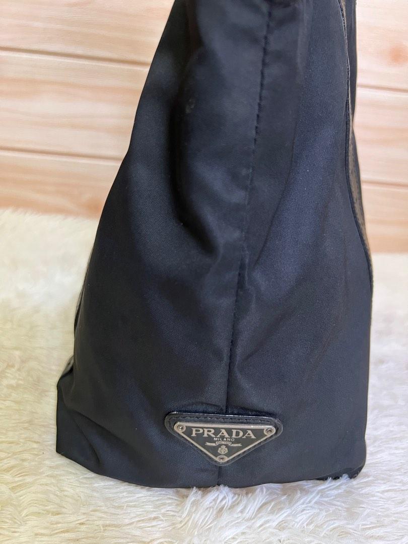Authentic Prada Tessuto Nylon Tote Bag (Category: Luxury Bags & Wallets) located in Cagayan de Oro. Submitted by riggstuffs (Listing ID 1101767493, Image 3). Description: Guaranteed Authentic Prada a Tessuto. nylon Bag Made in Italy Exterior area has no rubs or rips of the nylon material Interior is clean, with zip pocket Silver tone hardwares Leather strap has some signs of use but no cracks on the leather Dimension 9x14 in inches Handle drop is