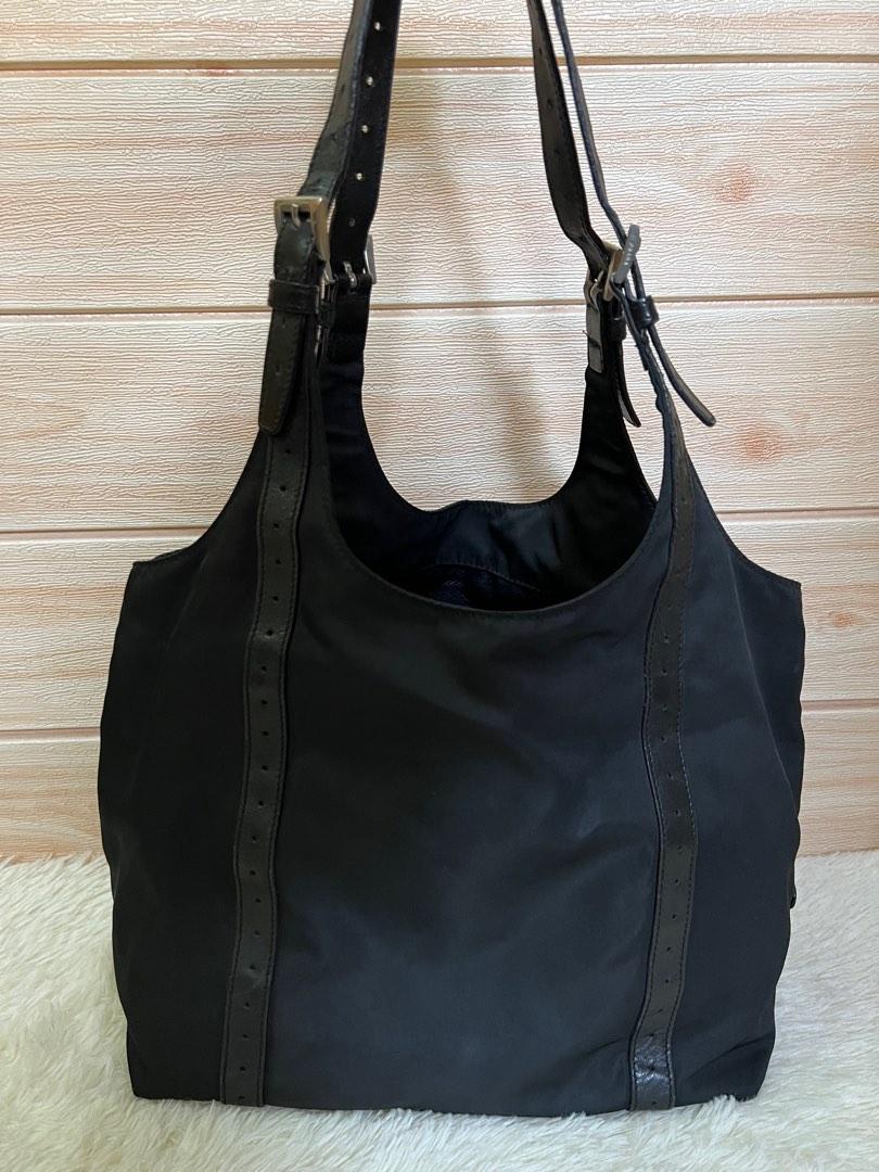 Authentic Prada Tessuto Nylon Tote Bag (Category: Luxury Bags & Wallets) located in Cagayan de Oro. Submitted by riggstuffs (Listing ID 1101767493, Image 1). Description: Guaranteed Authentic Prada a Tessuto. nylon Bag Made in Italy Exterior area has no rubs or rips of the nylon material Interior is clean, with zip pocket Silver tone hardwares Leather strap has some signs of use but no cracks on the leather Dimension 9x14 in inches Handle drop is