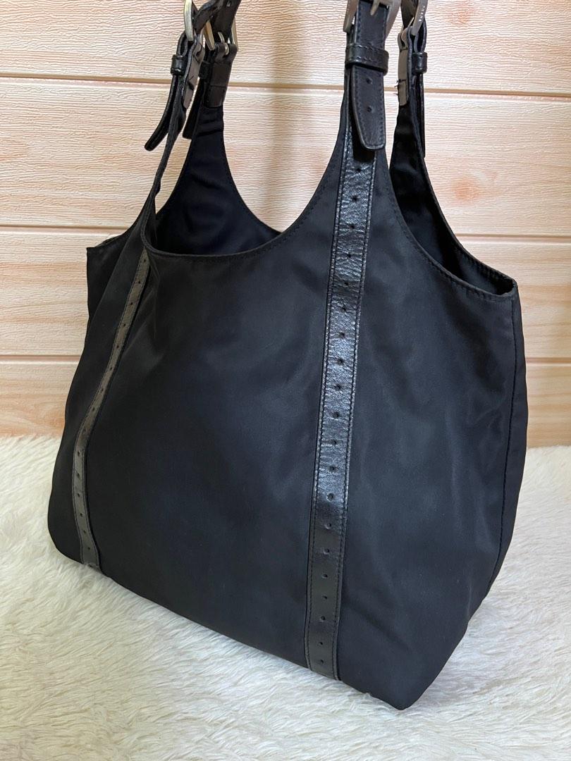 Authentic Prada Tessuto Nylon Tote Bag (Category: Luxury Bags & Wallets) located in Cagayan de Oro. Submitted by riggstuffs (Listing ID 1101767493, Image 2). Description: Guaranteed Authentic Prada a Tessuto. nylon Bag Made in Italy Exterior area has no rubs or rips of the nylon material Interior is clean, with zip pocket Silver tone hardwares Leather strap has some signs of use but no cracks on the leather Dimension 9x14 in inches Handle drop is