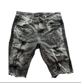 Black and smoke colored Jean shorts for teenage boy.