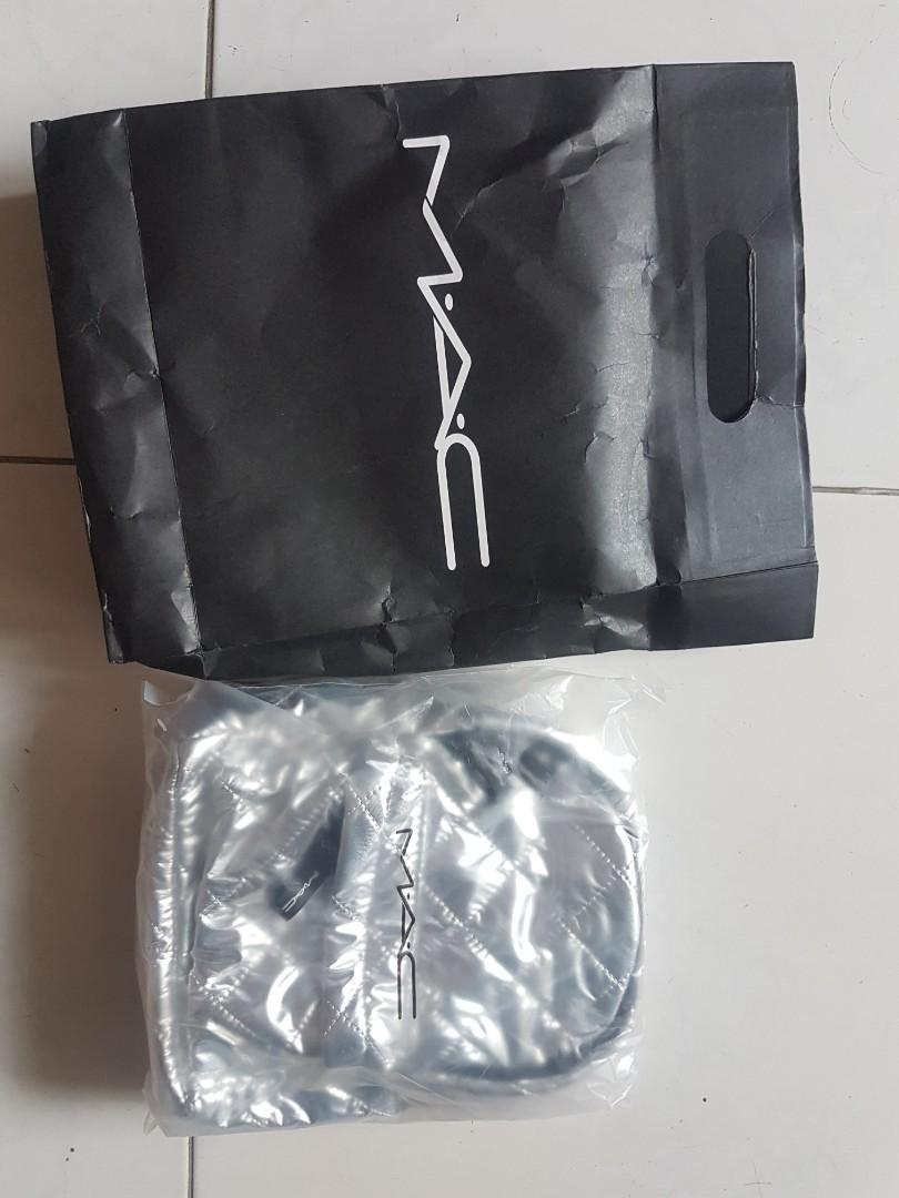 MAC silver backpack (Category: Backpacks) located in Singapore. Submitted by choykheng (Listing ID 1180146338, Image 1). Description: MAC make up brand.silver backpack. orginal packing.open up for photos only..