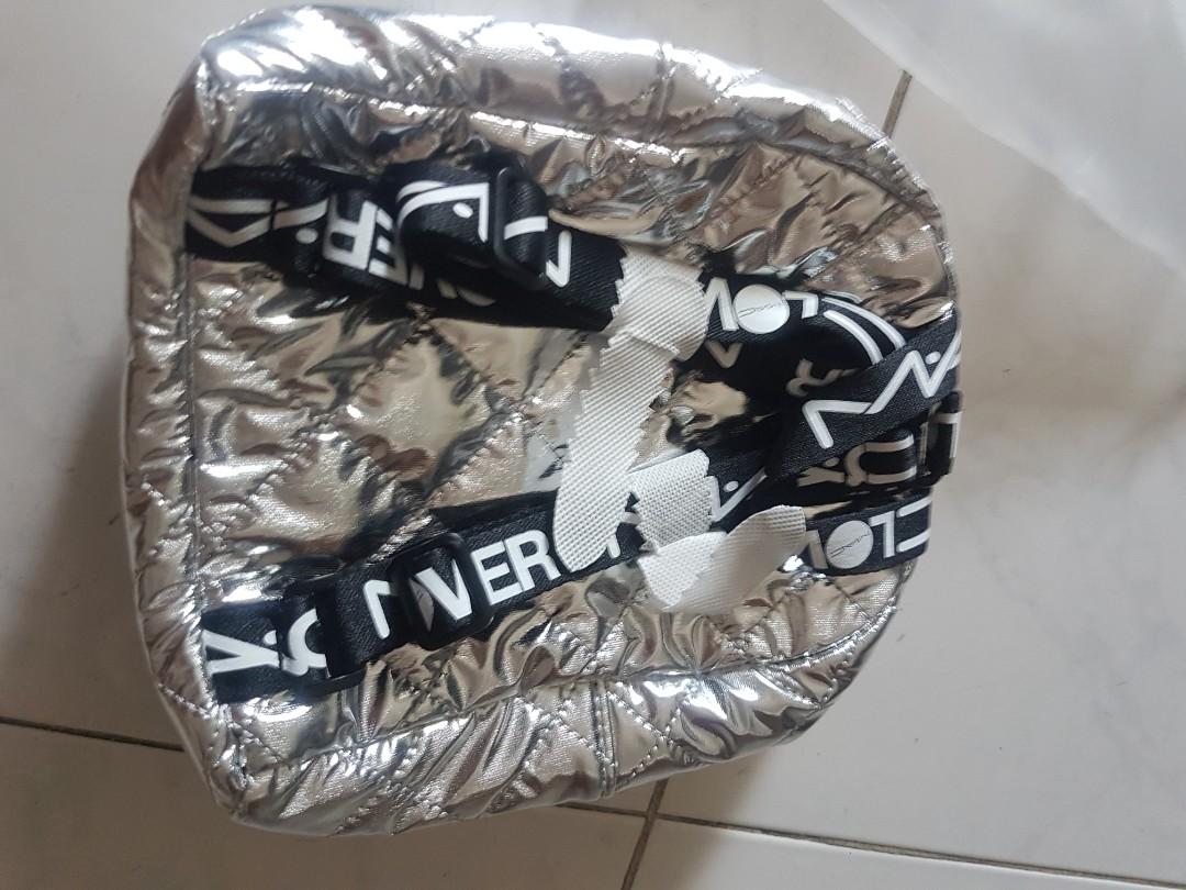 MAC silver backpack (Category: Backpacks) located in Singapore. Submitted by choykheng (Listing ID 1180146338, Image 3). Description: MAC make up brand.silver backpack. orginal packing.open up for photos only..