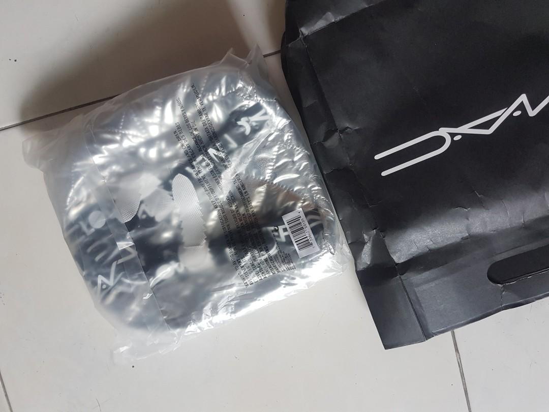 MAC silver backpack (Category: Backpacks) located in Singapore. Submitted by choykheng (Listing ID 1180146338, Image 2). Description: MAC make up brand.silver backpack. orginal packing.open up for photos only..