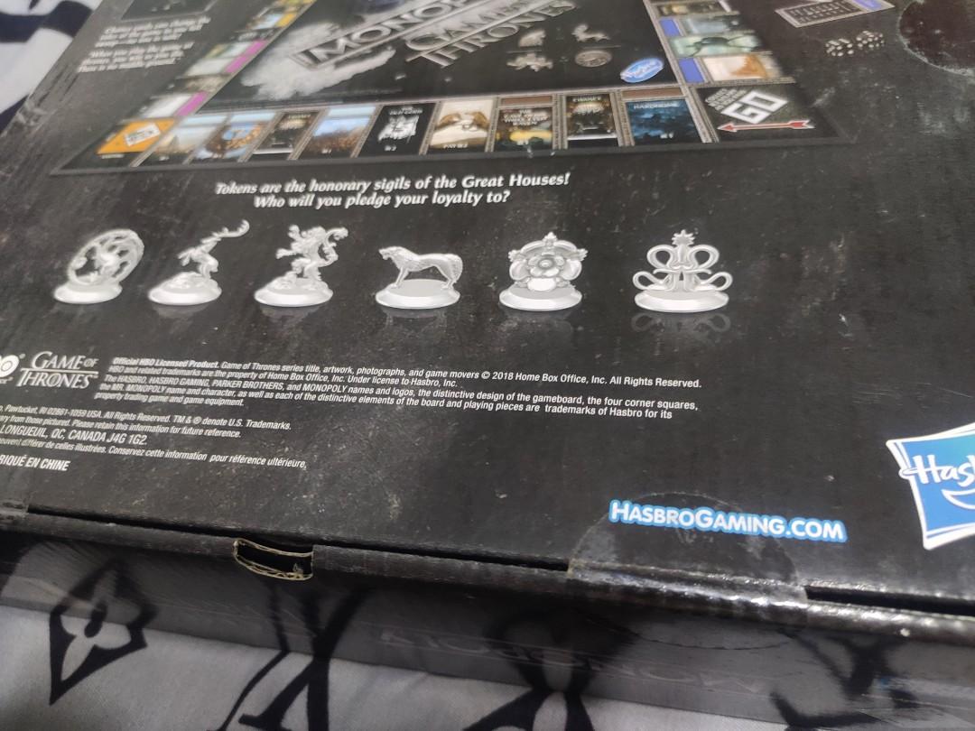 Game of Thrones Monopoly by Hasbro (Category: Board Games & Puzzles) located in Iloilo. Submitted by baotvr (Listing ID 1180386792, Image 3). Description: Excited with the new HBO TV series HOUSE OF THE DRAGON? Never been opened with seal intact. 100% Authentic HASBRO Monopoly gameboard based on the hit TV series from HBO: GAME OF THRONES Includes gameboard, 6 tokens, 28 Title Deed cards, Iron Throne card holder with musical stand, 32 Chance card