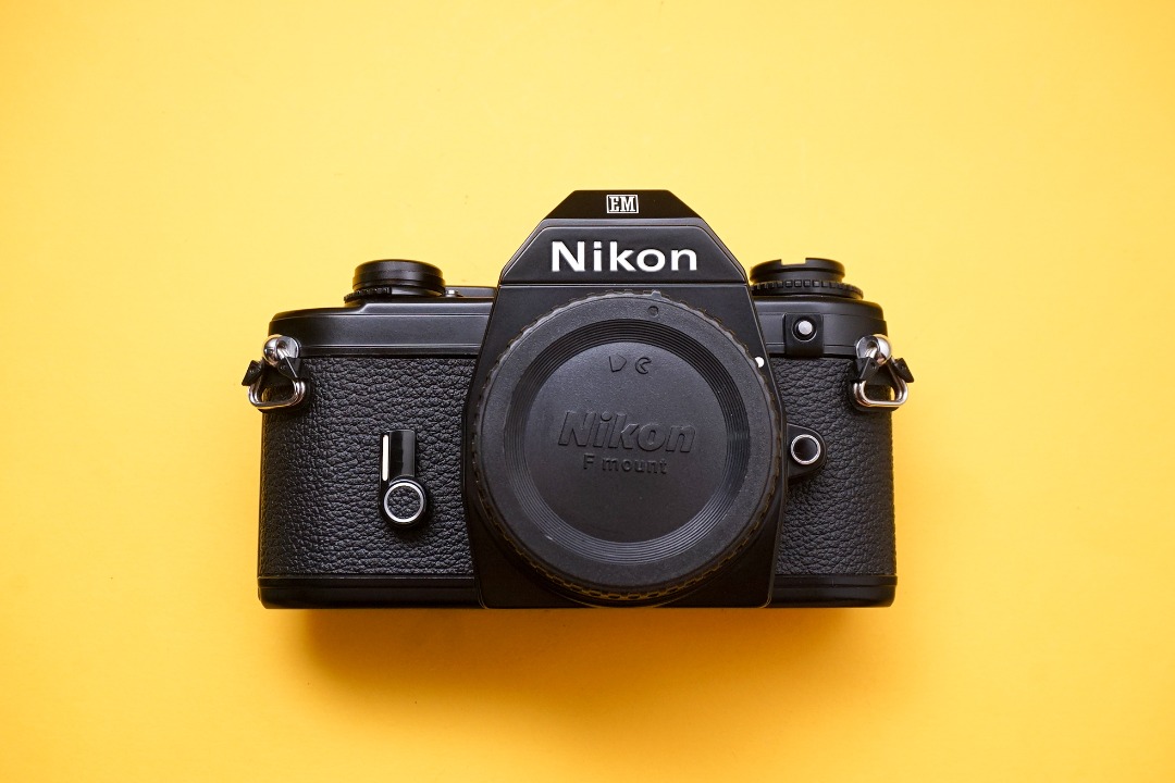 Nikon EM SLR film camera body, Photography, Cameras on Carousell