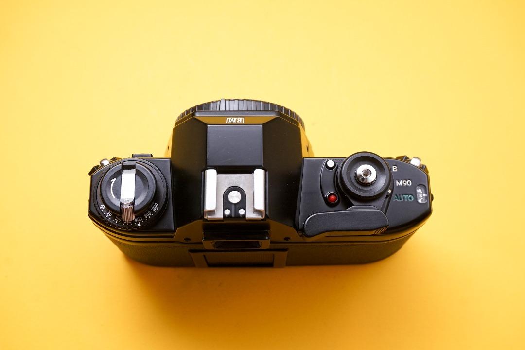 Nikon EM SLR film camera body, Photography, Cameras on Carousell