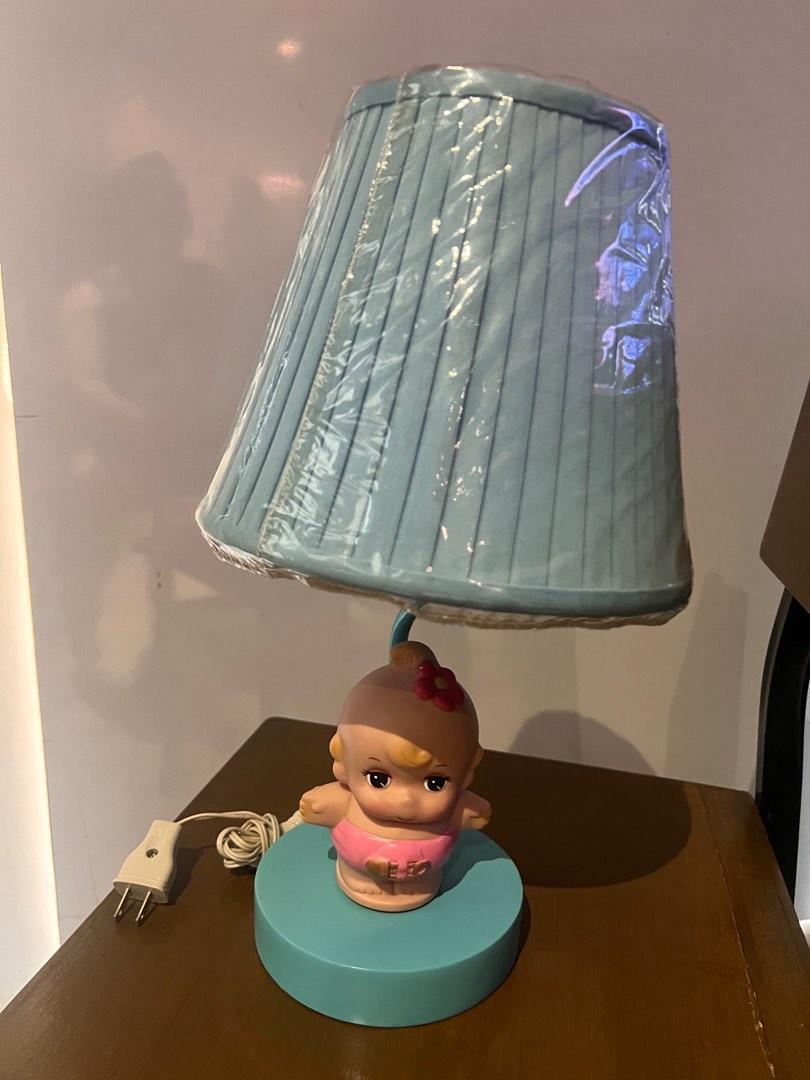 Kiddie Lampshade with coinbank (Category: Nursery Lighting & Decor) located in Quezon City. Submitted by geesfind (Listing ID 1180571065, Image 3). Description: Lightly used, but stored in the cabinet for quite sometime and no more kids in the house. Still in plastic cover. Lamp cover detachable Baby piggy bank detachable Height 15” Base 5.5” Lamp cover top 5.5” Lamp cover bottom 9” .