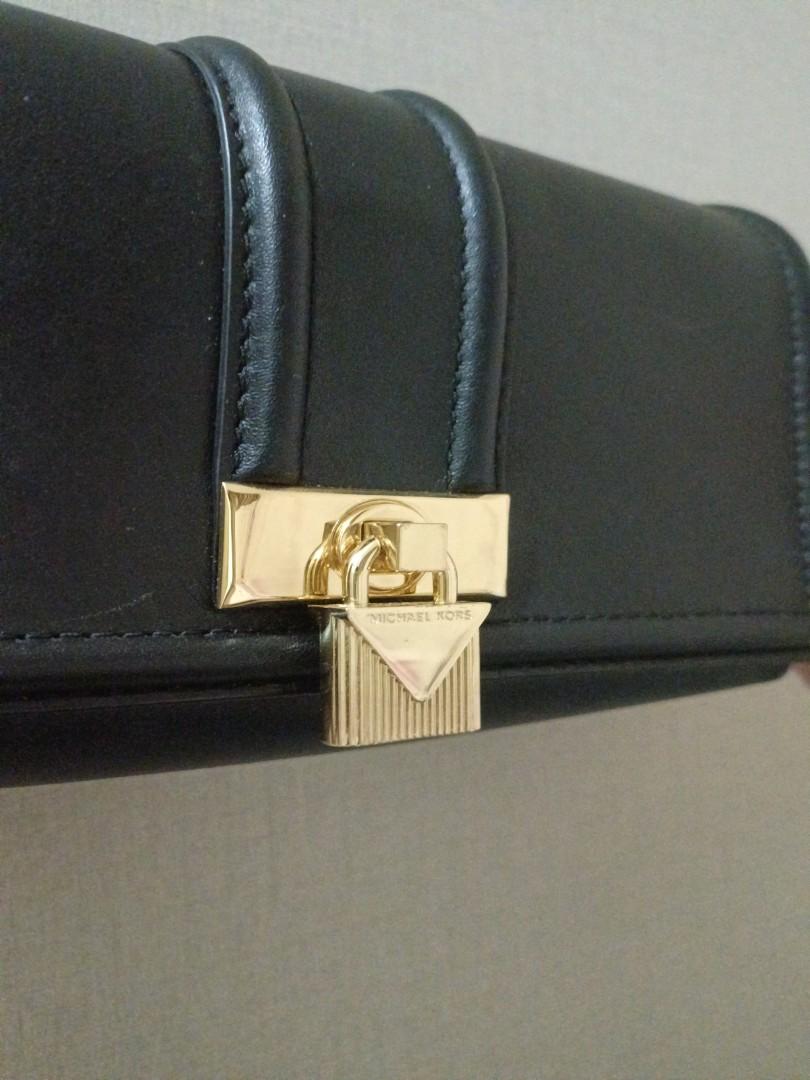 Michael kors black purse with gold lock clearance