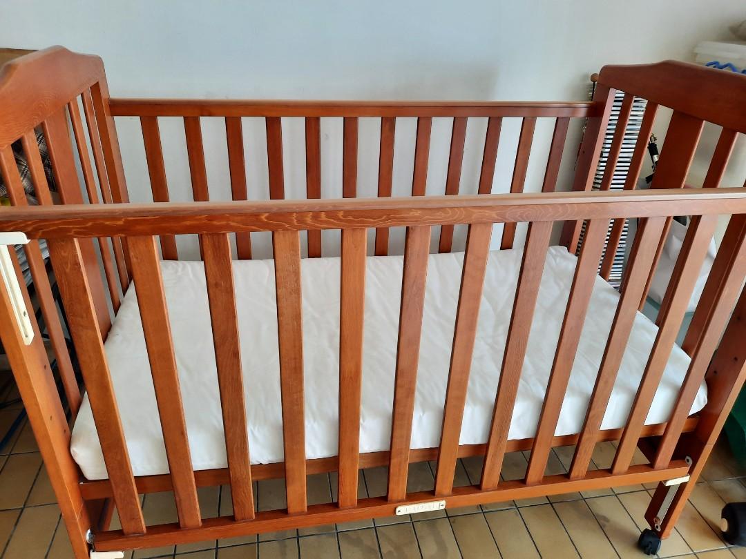 Lovely hardwood cot on wheels, Babies & Kids, Baby Nursery & Kids