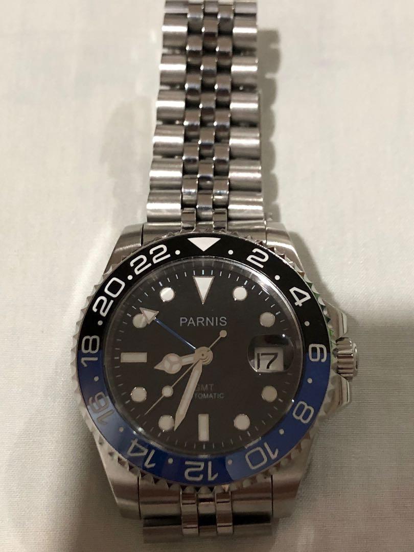 Parnis Batman GMT (Category: Men's Watches) located in Makati City. Submitted by eric103 (Listing ID 1001229155, Image 3). Description: Parnis GMT 1 Parnis Batman GMT 40mm Pre-loved, well used Automatic Handwinding and hacking Jubilee bracelet -Parnis Batman GMT With extra 1 rubber b strap Watch only, no box hairline scratches due to usage. Meet up. Buendia Makati, near Pacific Star Bldg. .
