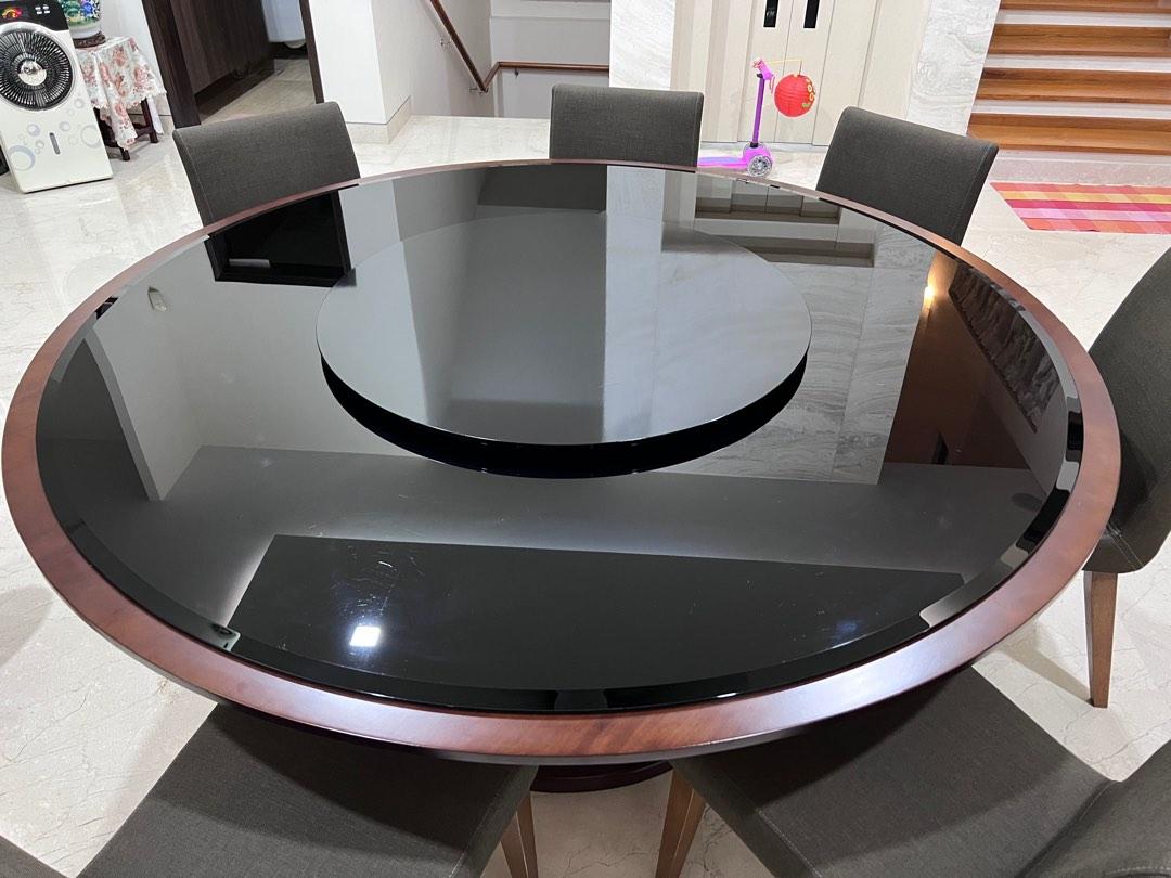 Dining Table (Category: Tables & Sets) located in Singapore. Submitted by ge012ge (Listing ID 1181445374, Image 1). Description: Customized dining table, complete with matching Lazy Susan. -168.5cm diameter tempered glass table top with chamfered edge -85cm diameter lazy susan, steel ring -wood base 4x support legs, walnut stained, disassembled Price reduced. Glass is wider than base table, photo is to show glass condition. Overall 8/10 with mino