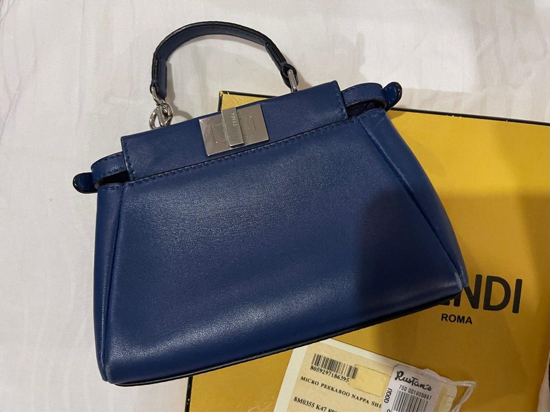 Fendi Micro Peekaboo Bag (Category: Luxury Bags & Wallets) located in Quezon City. Submitted by missalex87 (Listing ID 1181341691, Image 3). Description: pre-owned Micro Peekaboo bag featuring 2 inner compartments divided by a partition with twist lock and button. Single handle with spring clip on one side and a long thin adjustable, removable shoulder strap. color : Royal Blue Material : Nappa leather Lining in Alcantara. Year: 2015 Fabric: Soft