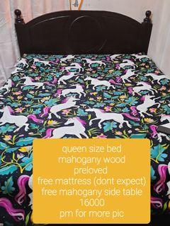 Queen size mahogany bed.