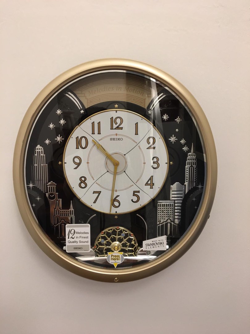 Seiko qxm478brh melody top in motion clock