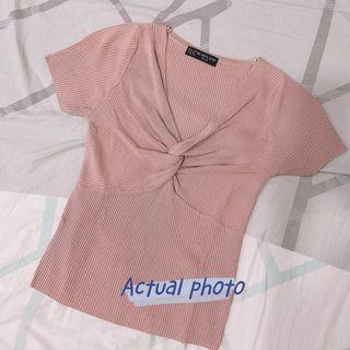 TLC’s pink blouse