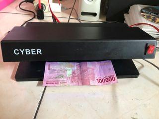 Alat deteksi uang palsu