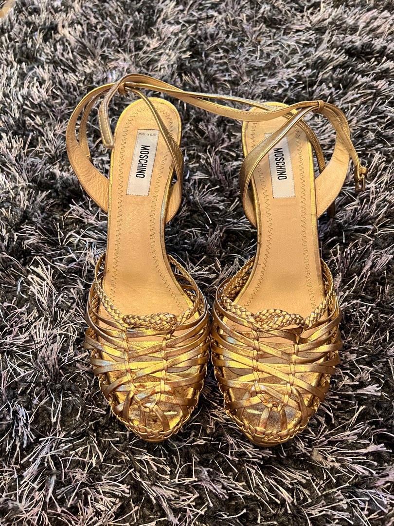 Auth Moschino Heels (Category: Heels) located in San Fernando. Submitted by authenticsph (Listing ID 1181515545, Image 1). Description: 💯Guaranteed Authentic MOSCHINO gold heels ✅Size 7 ✅Heels is in good condition and no damage at all. ✅Just discolorations on heel part. ❌ no inclusions If interested, PM me for more details.