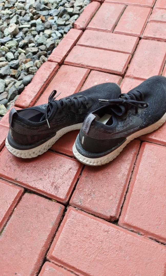 Nike Epic React Flyknit Running Shoes (Category: Sneakers) located in Quezon City. Submitted by jacqueline_velasco14 (Listing ID 1176301351, Image 3). Description: Black dark grey US 11.5/ UK 10.5/ EUR 44.5/29.5 cm payment via BPI or GCash.