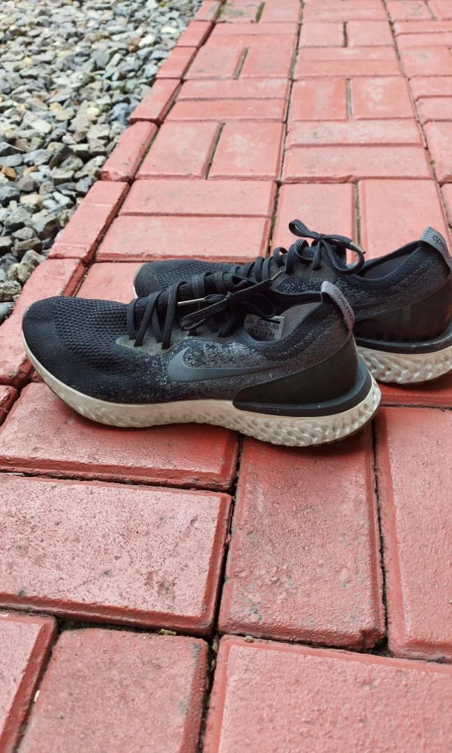 Nike Epic React Flyknit Running Shoes (Category: Sneakers) located in Quezon City. Submitted by jacqueline_velasco14 (Listing ID 1176301351, Image 1). Description: Black dark grey US 11.5/ UK 10.5/ EUR 44.5/29.5 cm payment via BPI or GCash.