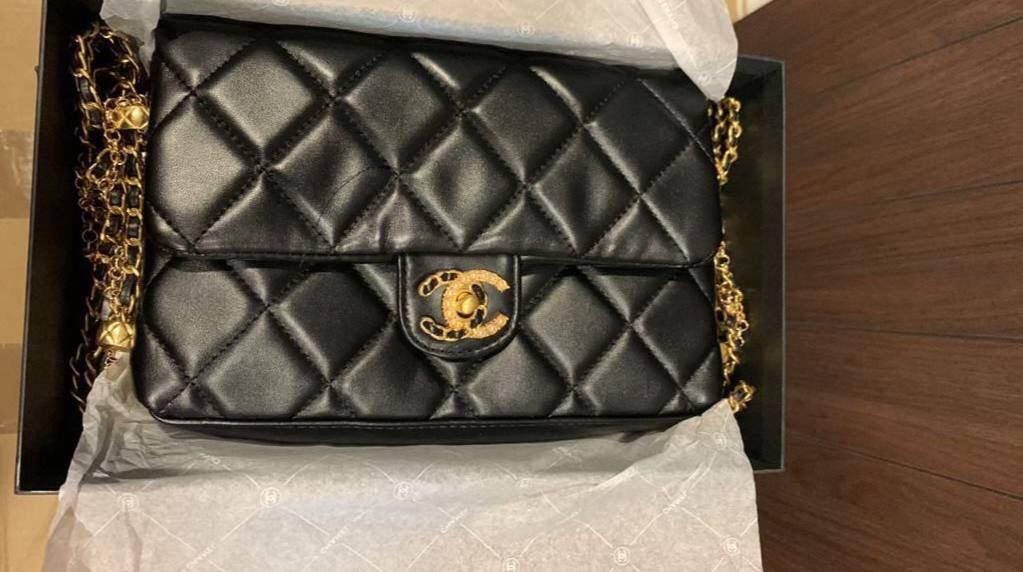 Sling bag. Chanel Complimentary gift bag. Luxury Bags Wallets