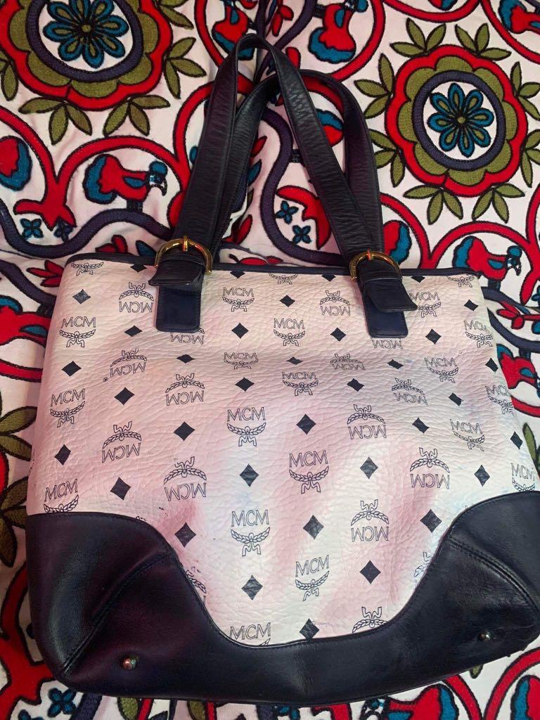 MCM tote (Category: Luxury Bags & Wallets) located in Baguio. Submitted by BagstacularbyJCT (Listing ID 1181953178, Image 3). Description: MCM Tote in Navy and white colorway. Bag has some color transfers on exterior as seen on pic. Bag is fully functional. .