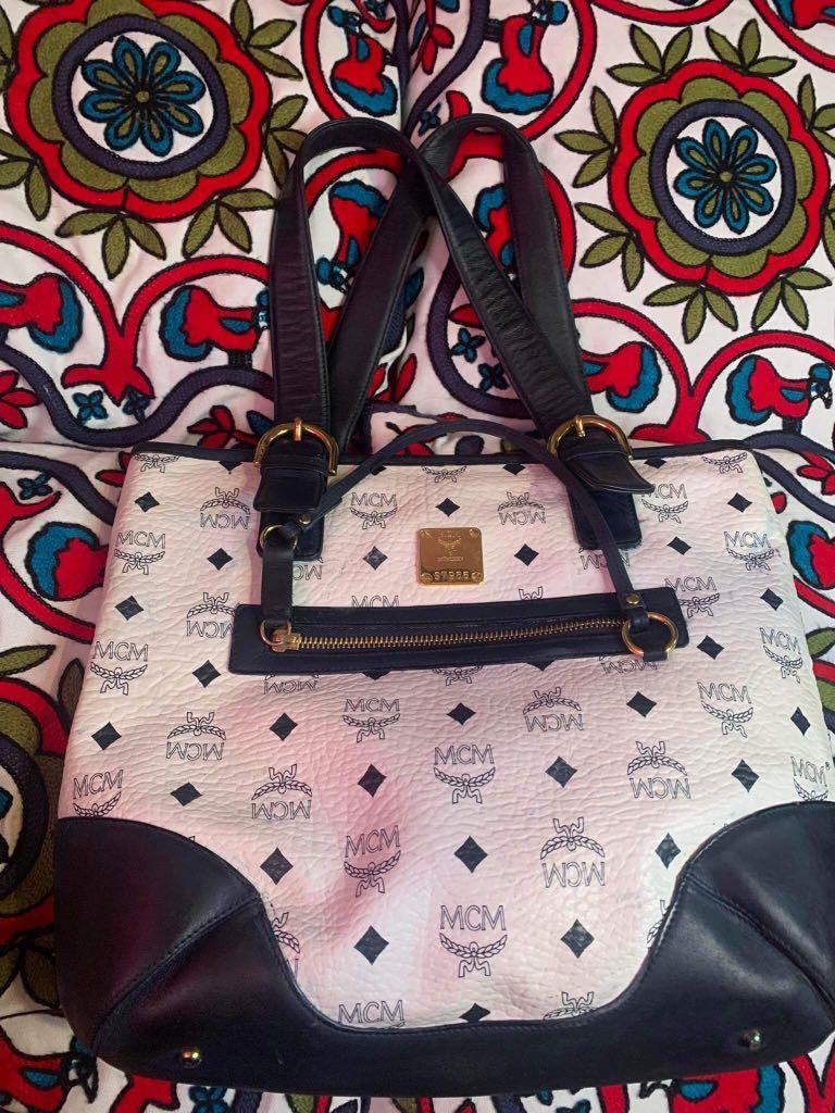 MCM tote (Category: Luxury Bags & Wallets) located in Baguio. Submitted by BagstacularbyJCT (Listing ID 1181953178, Image 2). Description: MCM Tote in Navy and white colorway. Bag has some color transfers on exterior as seen on pic. Bag is fully functional. .
