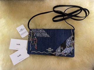 Hayden Monogram Washed Denim Crossbody Bag In B4indigo Midnig