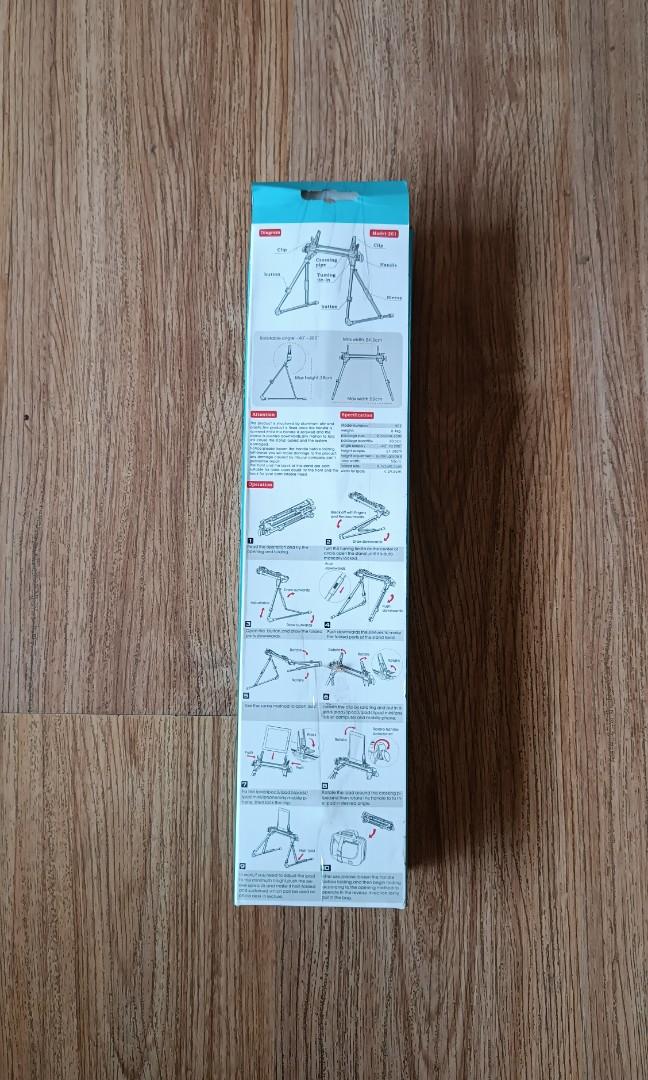 Smart phone tablet foldable stand holder (Category: Mounts & Holders) located in Manila. Submitted by jl_yu (Listing ID 1181932997, Image 3). Description: For sale: Brand new cellphone/tablet foldable stand holder -perfect for seniors and PWD -will fit 3inches to 10.5 inches devices -foldable, adjustable height -very light and sturdy location: pickup visayas ave qc. shipping can also be arranged 09l6-745-l867.
