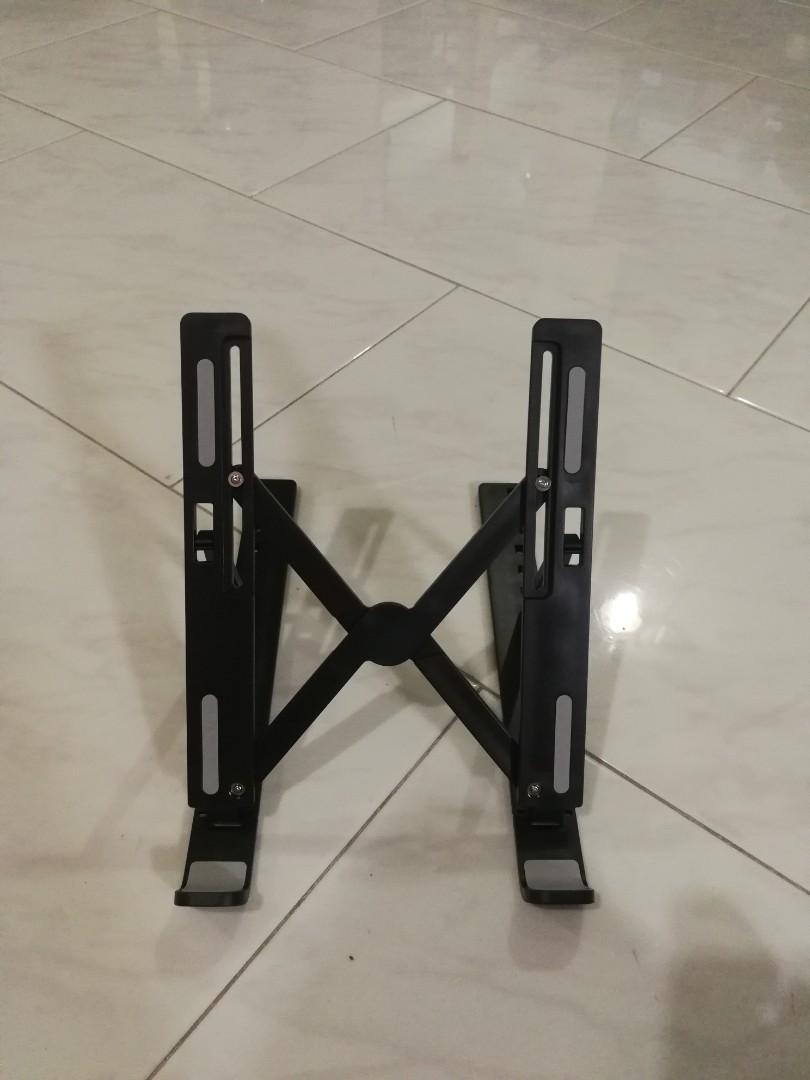 Notebook tablet bracket (Category: Mounts & Holders) located in Singapore. Submitted by dragon0 (Listing ID 1176585468, Image 1). Description: Name: notebook tablet bracket Material: plastic + metal Specifications : 281 * 60 * 18mm Colour : black/ white/ gray Net weight : 220g (+/- 5g) Angle : 10- speed adjustable angle Applicable models : laptops and tablets below 15.6 inches Support most tablets Can also support books and other items New Cash a