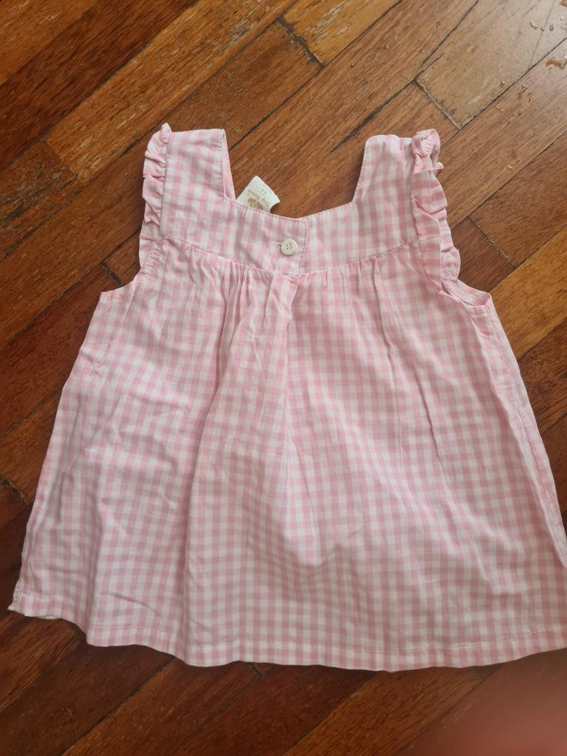 Tiny button pink top (Category: Babies & Kids Fashion) located in Shah Alam. Submitted by zerowastebabe (Listing ID 1176461405, Image 1). Description: worn once only.