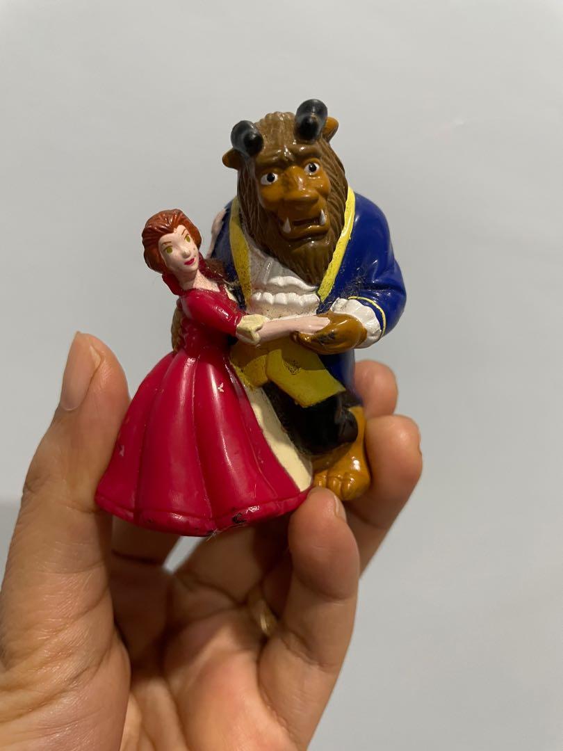 Beauty and the Beast figure (Category: Figurines & Statues) located in Carmona. Submitted by thepinkplayhouse (Listing ID 1176792441, Image 1). Description: Beauty (Princess Belle) and the Beast figure. Preloved condition. Needs cleaning. Marking: Disney Height: 2.5 inches only.
